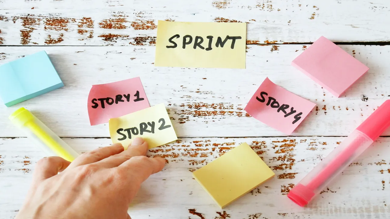 Colorful notes with "story" written on them and a person's hand