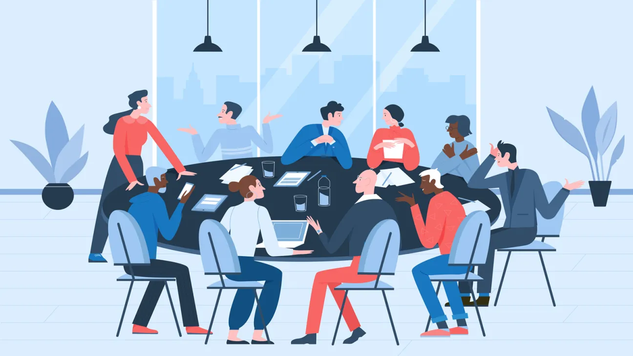 A group of people sitting at a round table