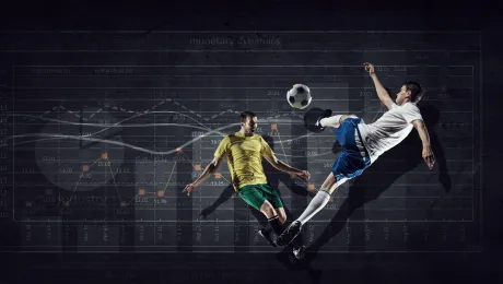 Two soccer players in front of data charts.